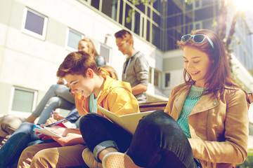 group of students with notebooks at school yard