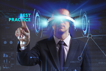 Business, Technology, Internet and network concept. Young businessman working in virtual reality glasses sees the inscription: Best practice