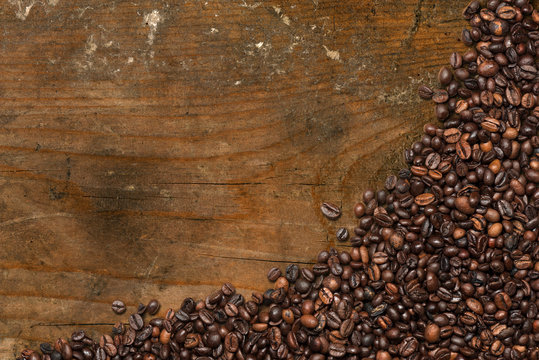 Coffee Beans on Wood Background