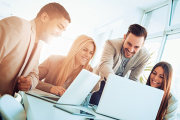Happy smiling business team in office