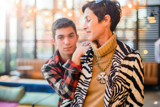 Teenage boy with stylish mother