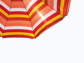 Colored beach umbrella isolated on white (clipping path included)
