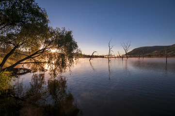 Fototapeta premium Sunrise reflections on the water