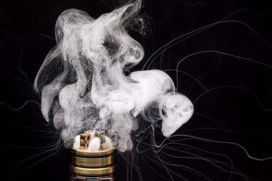  Burning of Electronic cigarette. Popular vaporizing e-cig gadget to vape glycerin e-liquid