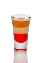 Cocktail with champagne, beer and liquor in shot glass isolated on white. (Soft focus photo)