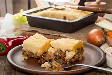 Shepherd's pie traditional english dish. Recipe with minced beef, lamb, carrot, onion, celery, mashed potato.