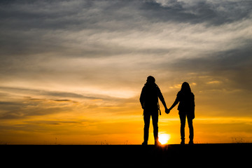 Silhouette of couple traveler.