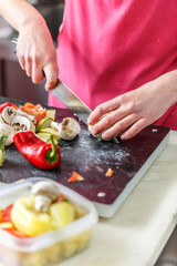 Chef is cutting fresh vegetables