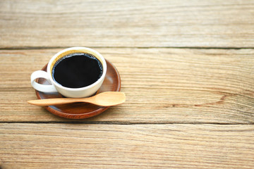 Stock Photo - Close up Coffee cup on the wooden table in the morning