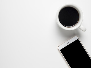 Cup of coffee and White Smart phone on white table