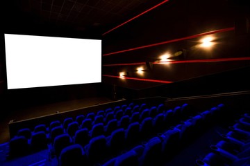 Naklejka premium Cinema hall, movie theater, theatre with blue armchairs and white screen with copy space