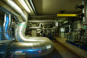 Obraz premium Equipment, cables and piping as found inside of a modern industrial power plant