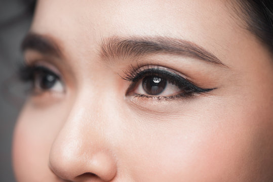 Asian model eye close-up with long eyelashes. Selective focus