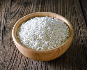 rice in  bowl on wooden