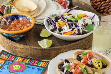 Mini taco boats with black beans and vegetables.