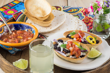 Mini taco boats with black beans and vegetables.