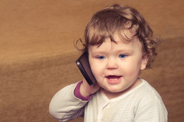 Little girl talking on the phone