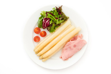 White asparagus with salad and ham isolated on white background.Top view

