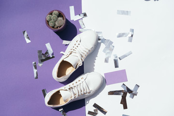 Beauty blog concept. Flat lay feminini white keds on white background. White sneakers.