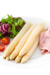 White asparagus with salad and ham isolated on white background


