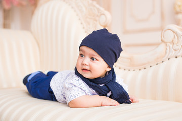 Portrait of a cute baby boy smiling. Adorable four month old child.