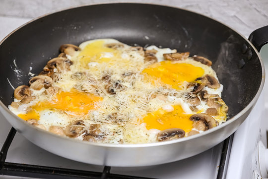 Fried eggs with mushrooms for a breakfast