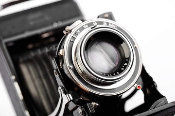 Old camera on white background on desk