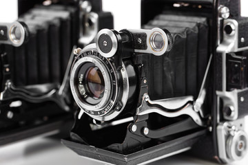 Old camera on white background on desk