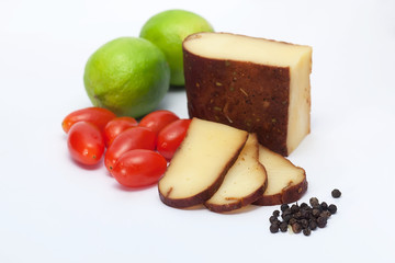 Cheese, lemon and tomatoes isolated