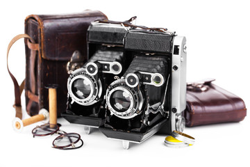 Old camera on white background on desk