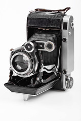 Old camera on white background on desk