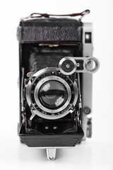 Old camera on white background on desk