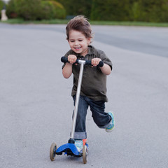 Little boy on scooter © Microgen