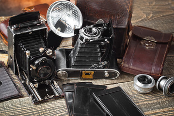 Old camera on an old background on a close-up table