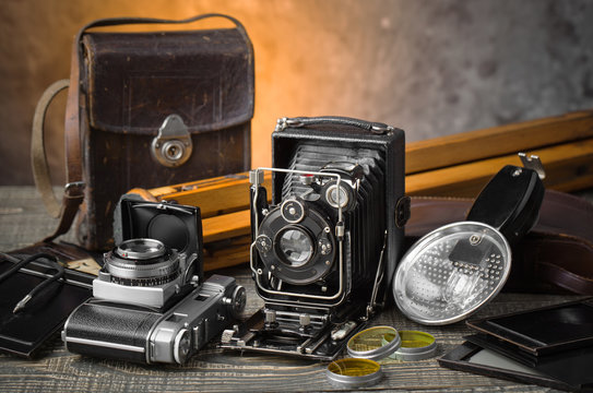 Old camera on an old background on a close-up table