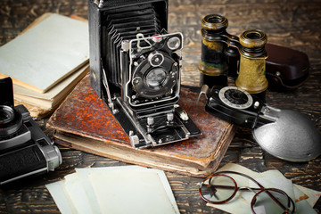 Old camera on an old background on a close-up table