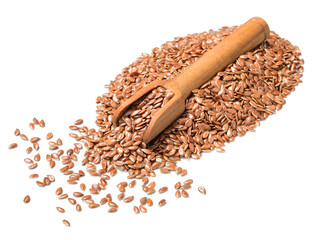 uncooked flax seeds in the wooden spoon