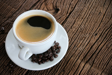 Morning coffee on wooden table.