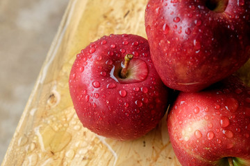 Drops on red apple wet delicious