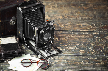 Old camera on an old background on a close-up table