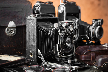 Old camera on an old background on a close-up table