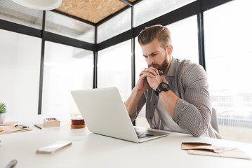 Serious male manager in bureau