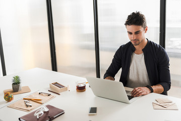 Fototapeta premium Confident office worker doing his job