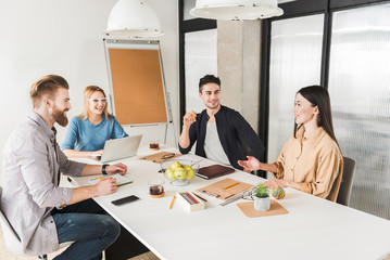 Jolly work in office among co-workers