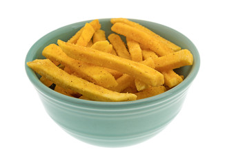 Sweet potato fries in a small bowl isolated on a white background.