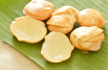 toddy palm tropical fruit on banana leaf