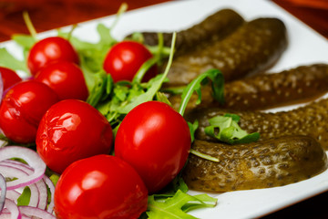 Different types of vegetables on white plate.