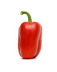 Single red bell pepper or capsicum isolated on white background