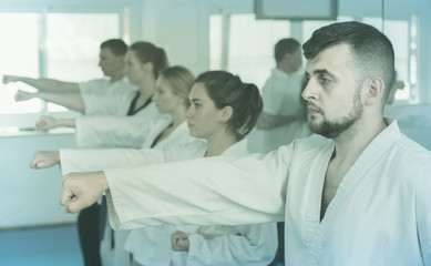 Obraz premium trainees expressing interest in attending karate class