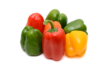 Fresh colorful bell peppers on the white background